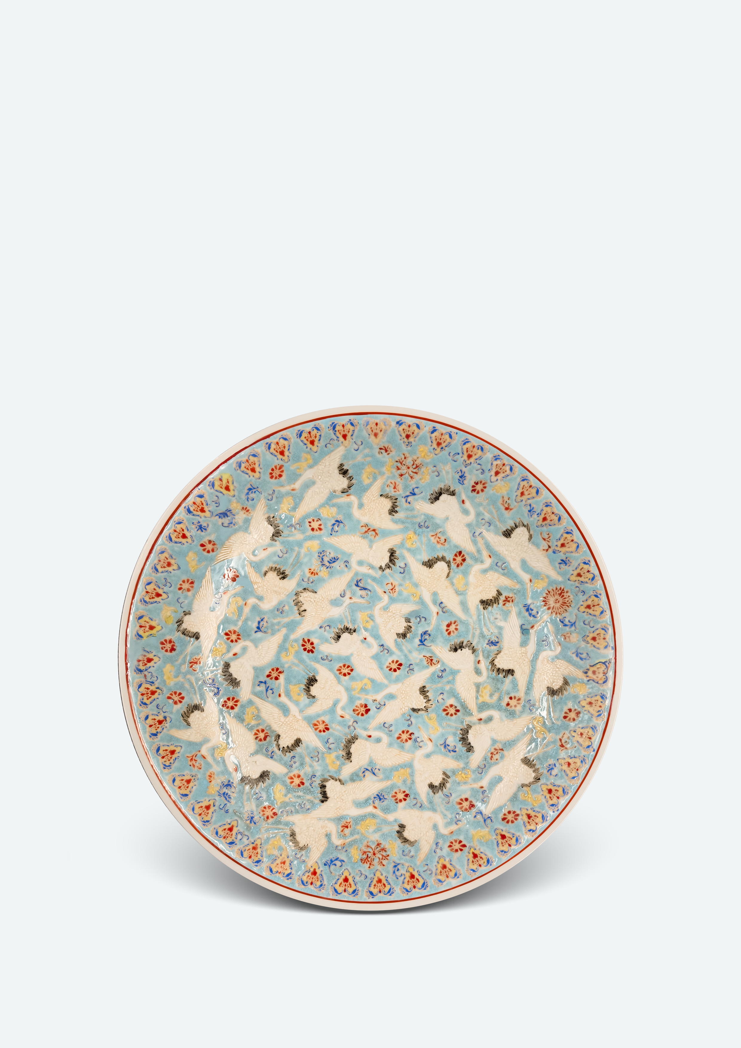 清雍正 藍地粉彩白鶴盤